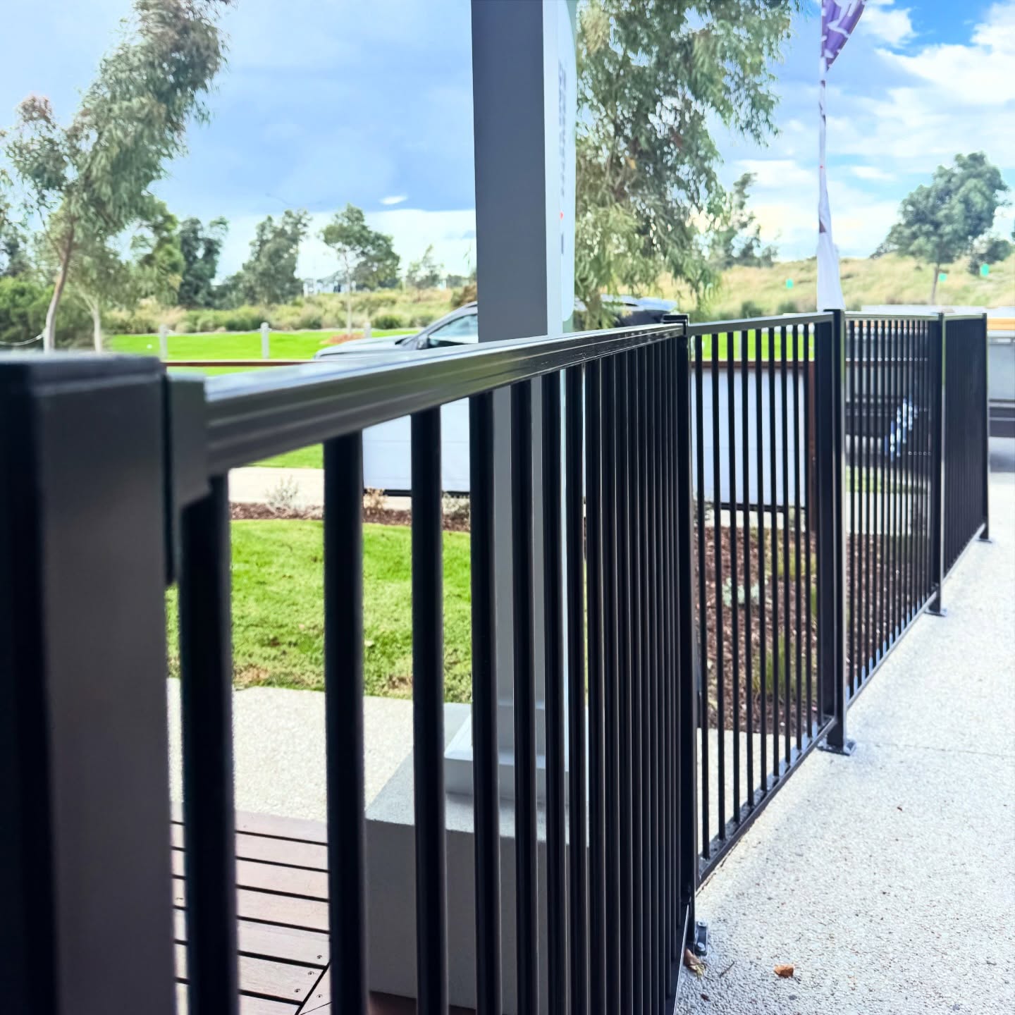 Black aluminium balustrade on a hardwood deck handrail finished by B. Rhodes Carpentry
