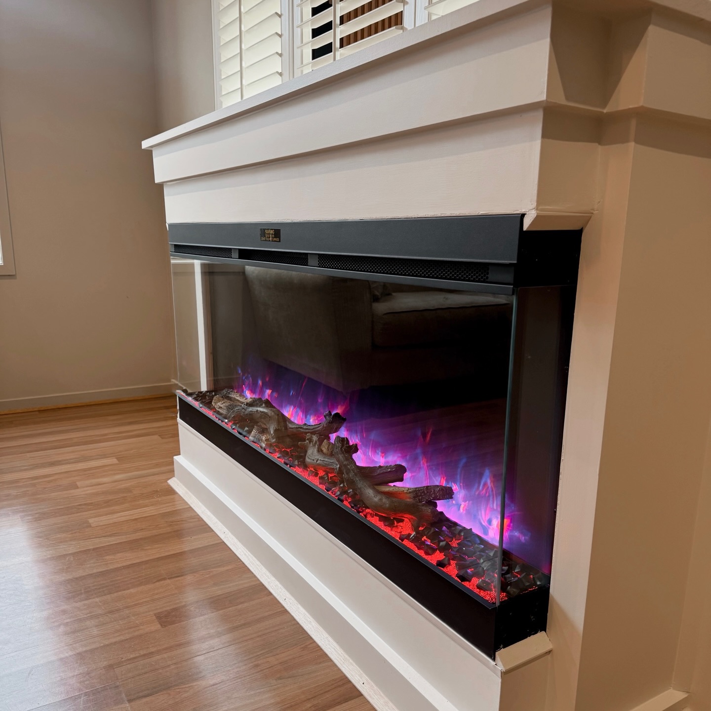 Custom feature wall and electric fireplace built into a Melbourne home